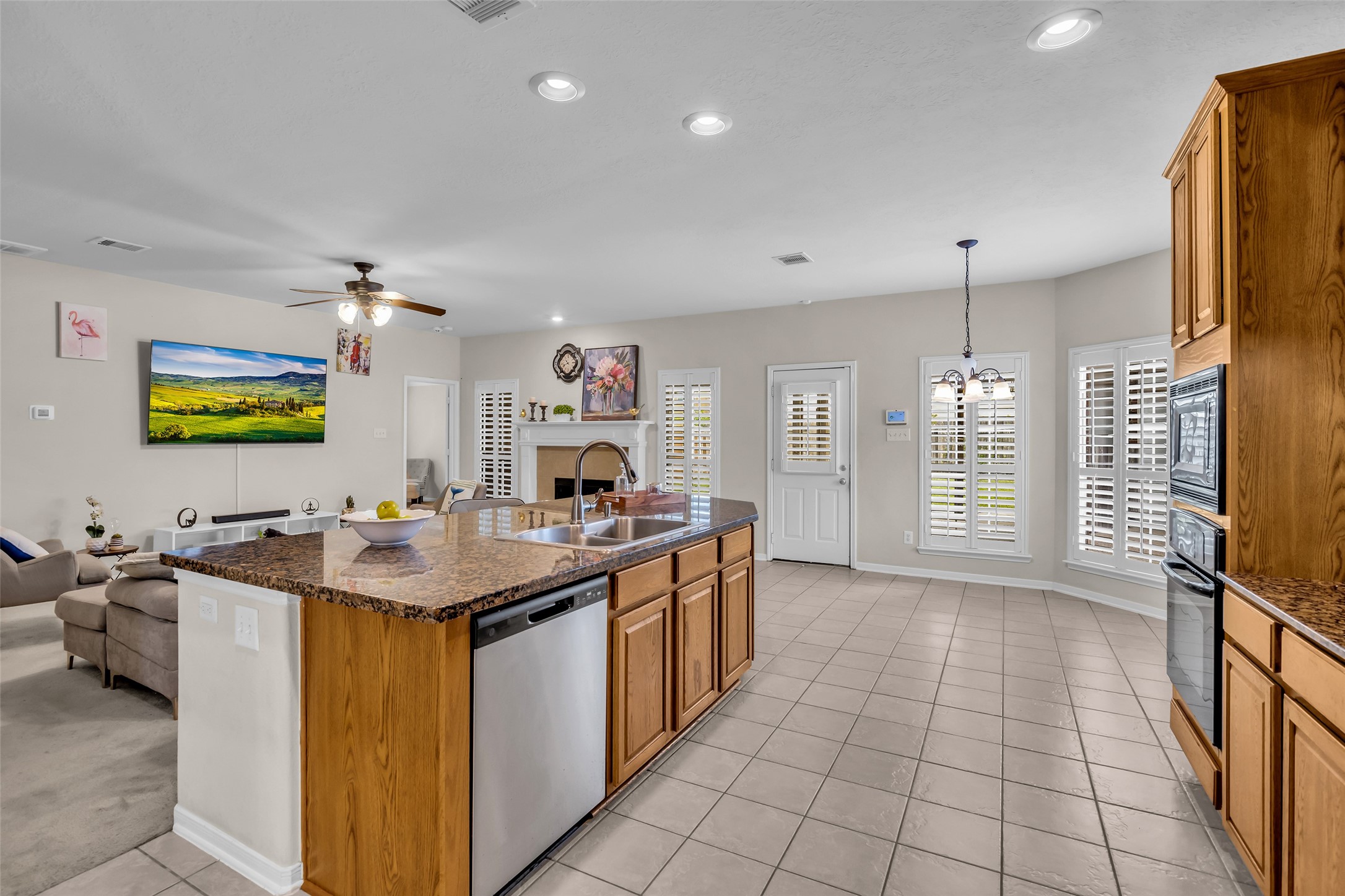 6807 Chapelfield Lane Houston, TX 77049 - Photo 12 of 42 a kitchen with a sink a counter top space and stainless steel appliances