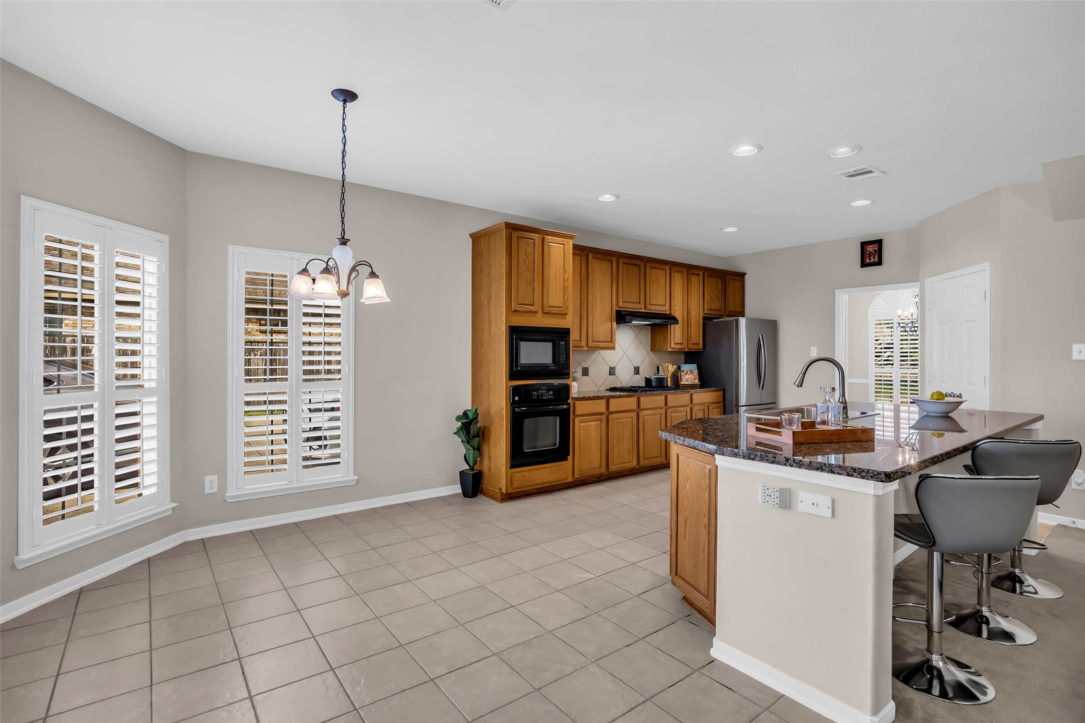 6807 Chapelfield Lane Houston, TX 77049 - Photo 17 of 42 a view of kitchen with furniture and window