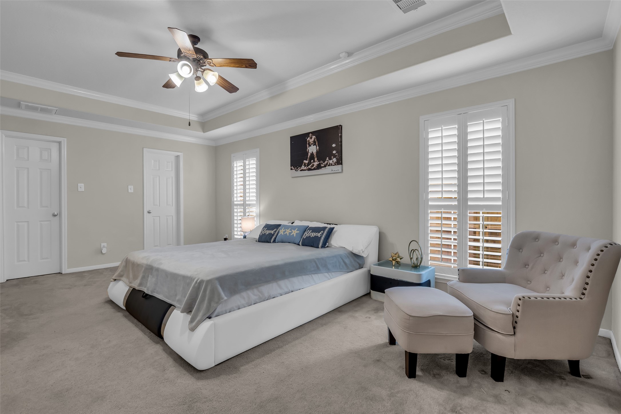 6807 Chapelfield Lane Houston, TX 77049 - Photo 26 of 42 a spacious bedroom with a bed and a couch