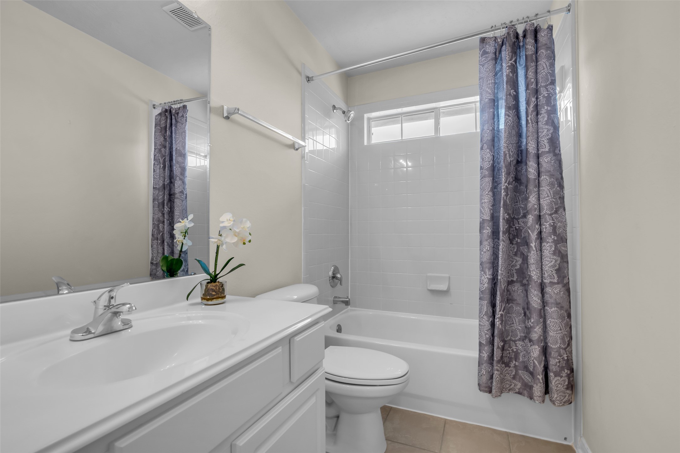 6807 Chapelfield Lane Houston, TX 77049 - Photo 37 of 42 a bathroom with a bathtub a sink and a large mirror
