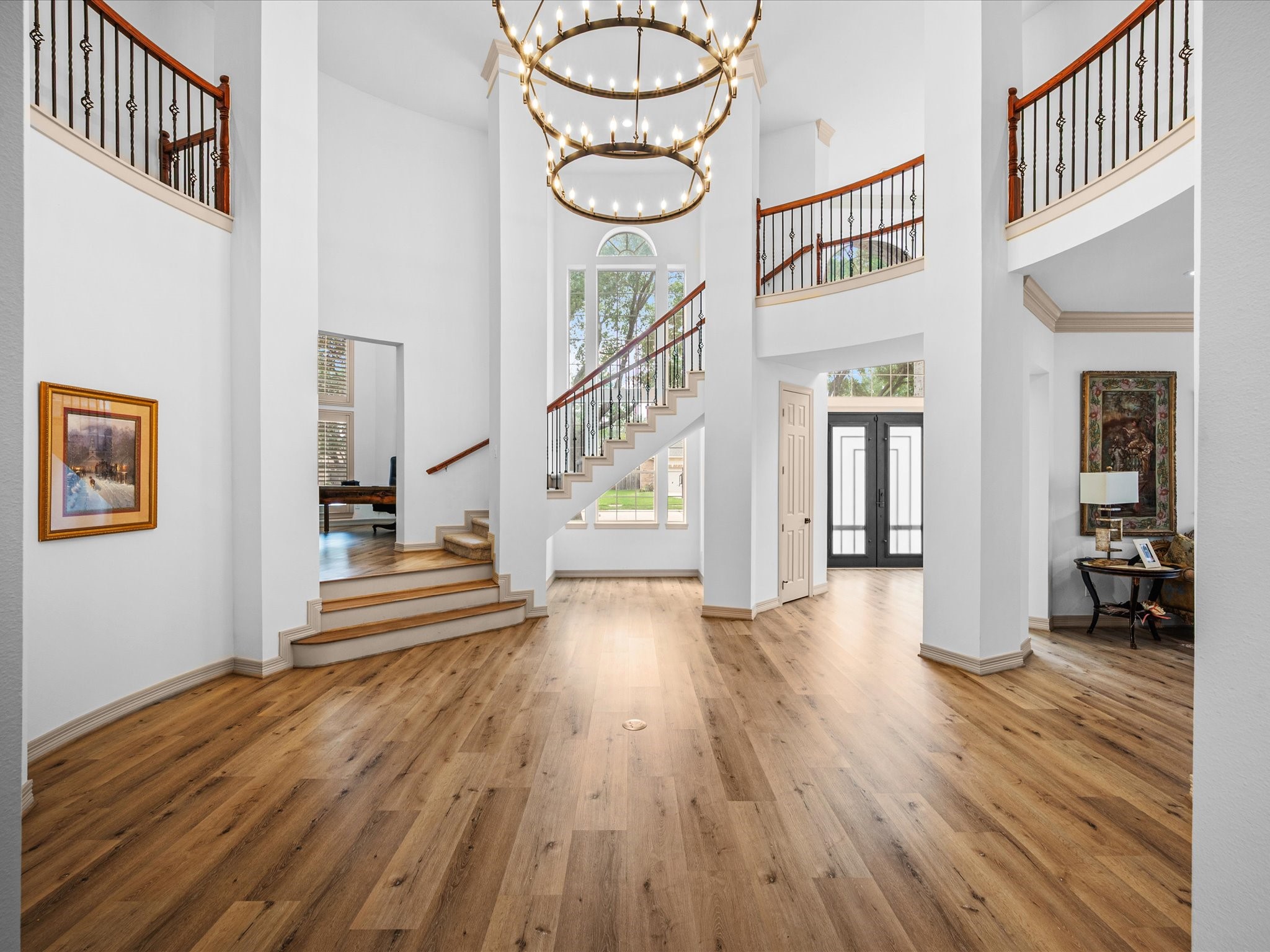 11410 Carson Field Lane Cypress, TX 77433 - Photo 1 of 47 Elegant staircase entry way with dramatic ceilings and a bright, airy design.