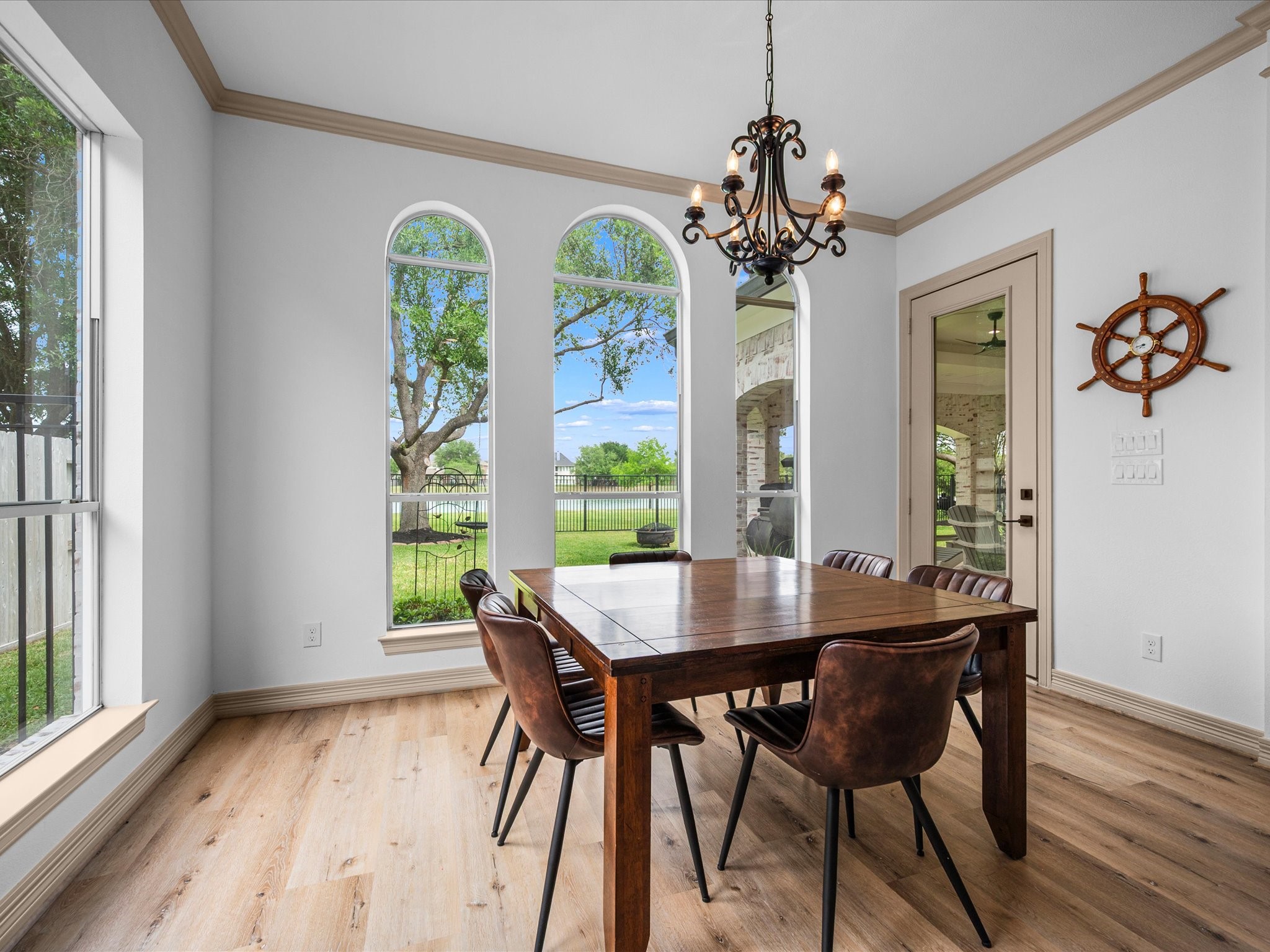 11410 Carson Field Lane Cypress, TX 77433 - Photo 14 of 47 Breakfast area with natural light and peaceful backyard lake views.