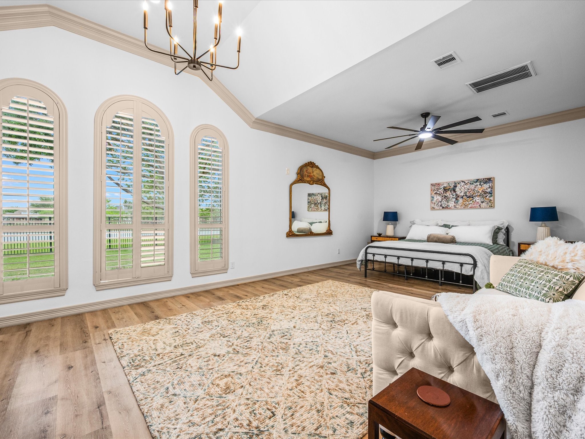 11410 Carson Field Lane Cypress, TX 77433 - Photo 21 of 47 Spacious primary bedroom with large windows and updated flooring.