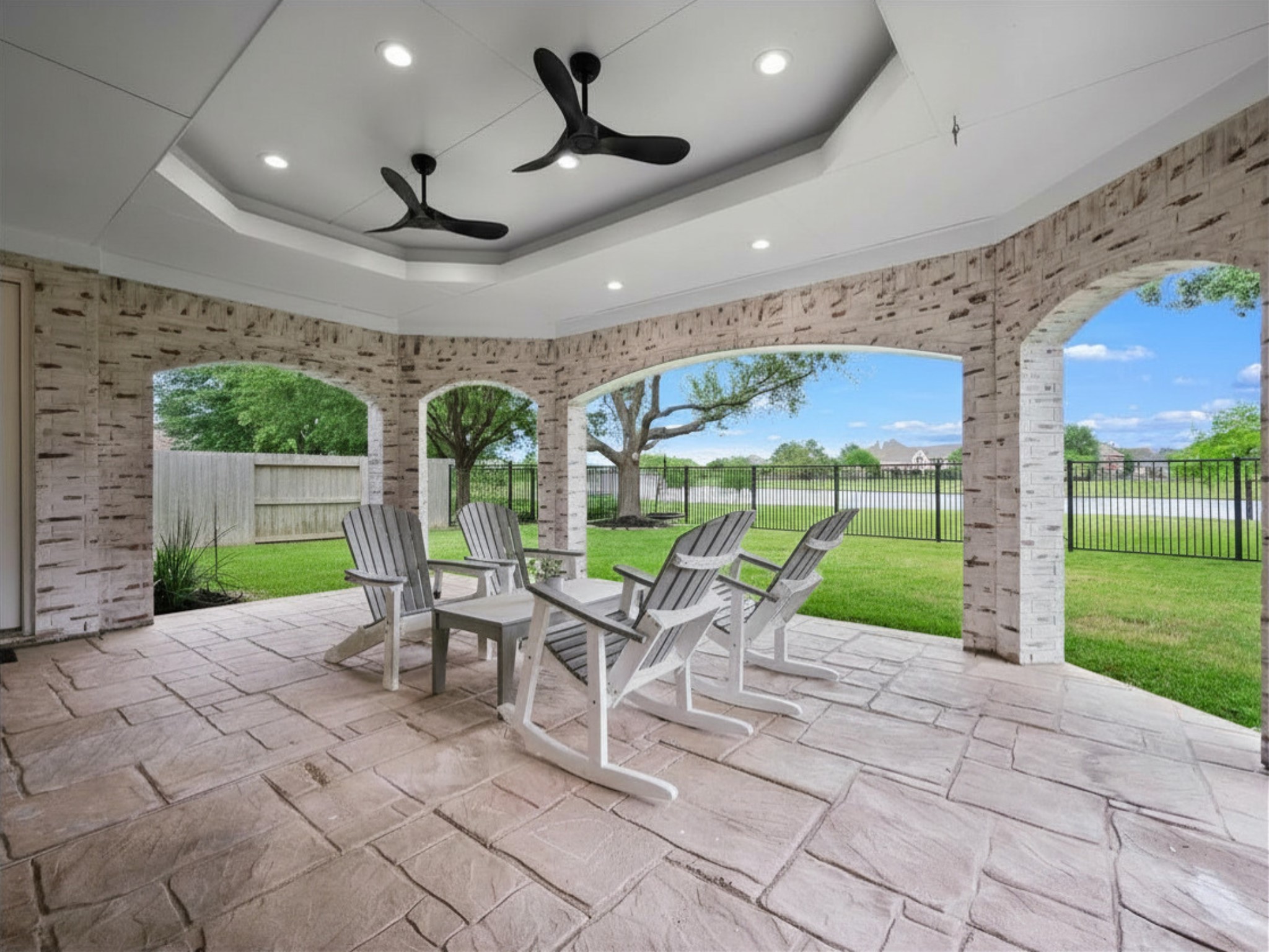 11410 Carson Field Lane Cypress, TX 77433 - Photo 41 of 47 Covered patio with lake views, ideal for outdoor living and entertaining.