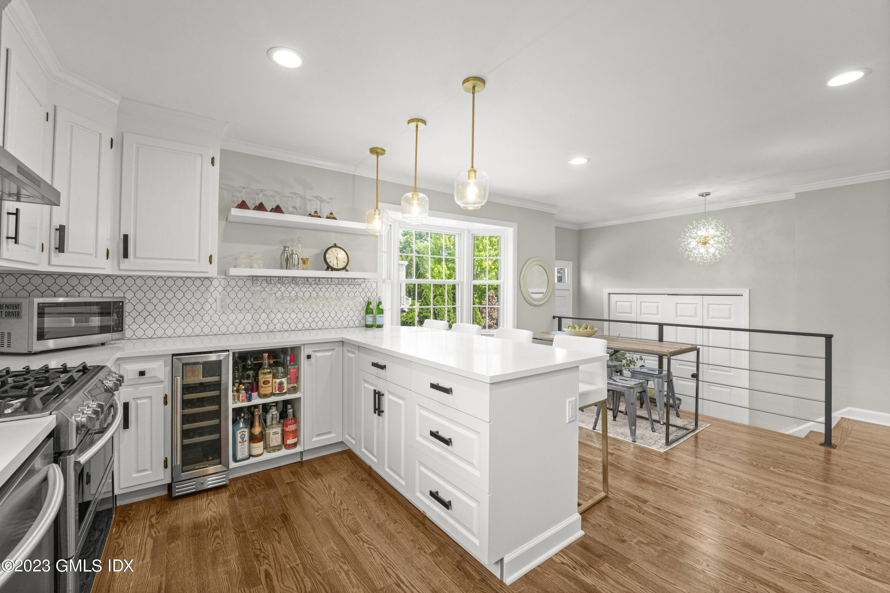 172 Field Point Road, Unit 6 Greenwich, CT 06830 - Photo 11 of 36 a kitchen with stainless steel appliances granite countertop a stove and a wooden floors