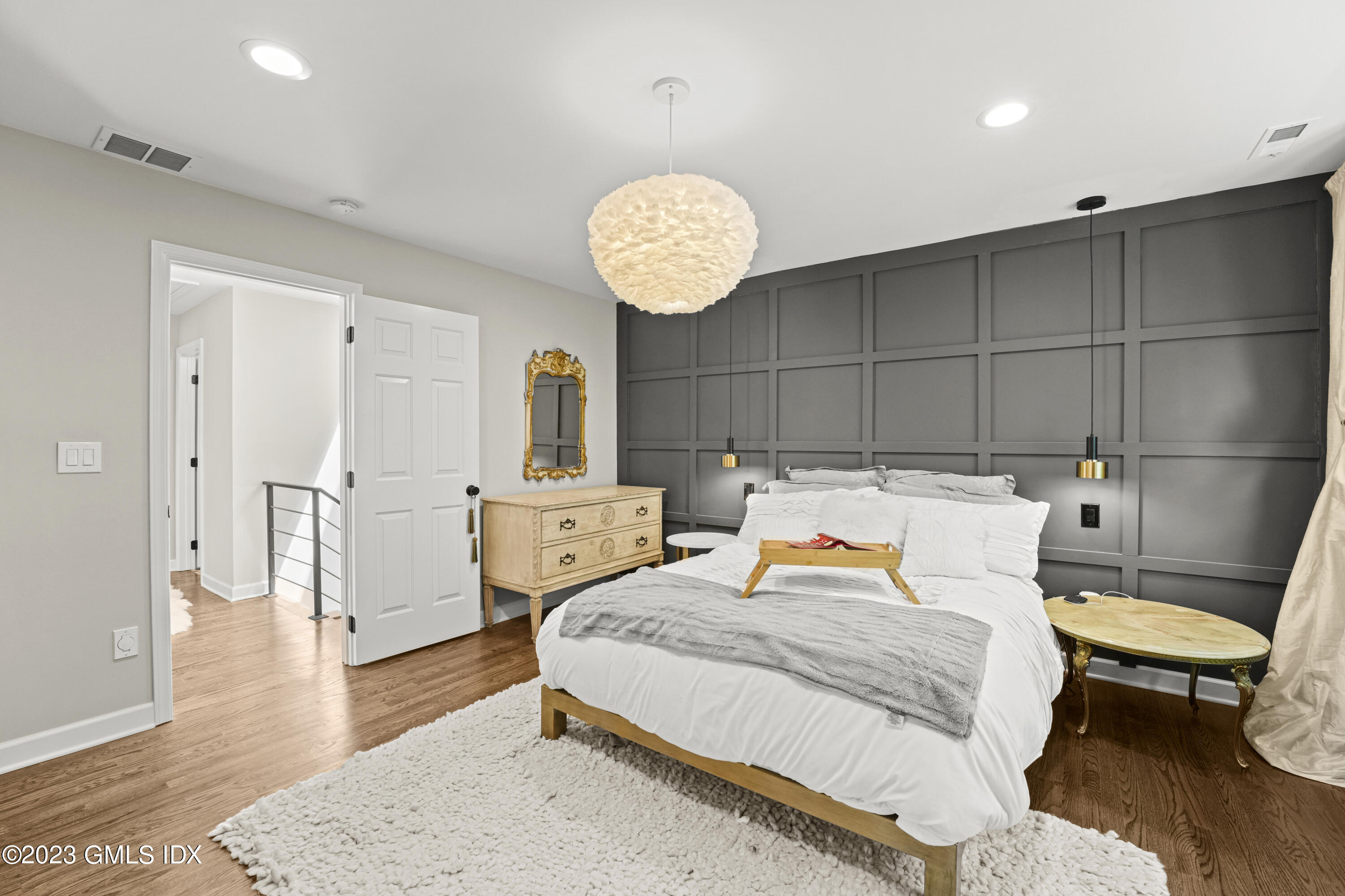 172 Field Point Road, Unit 6 Greenwich, CT 06830 - Photo 13 of 36 a bedroom with a bed and a table in it