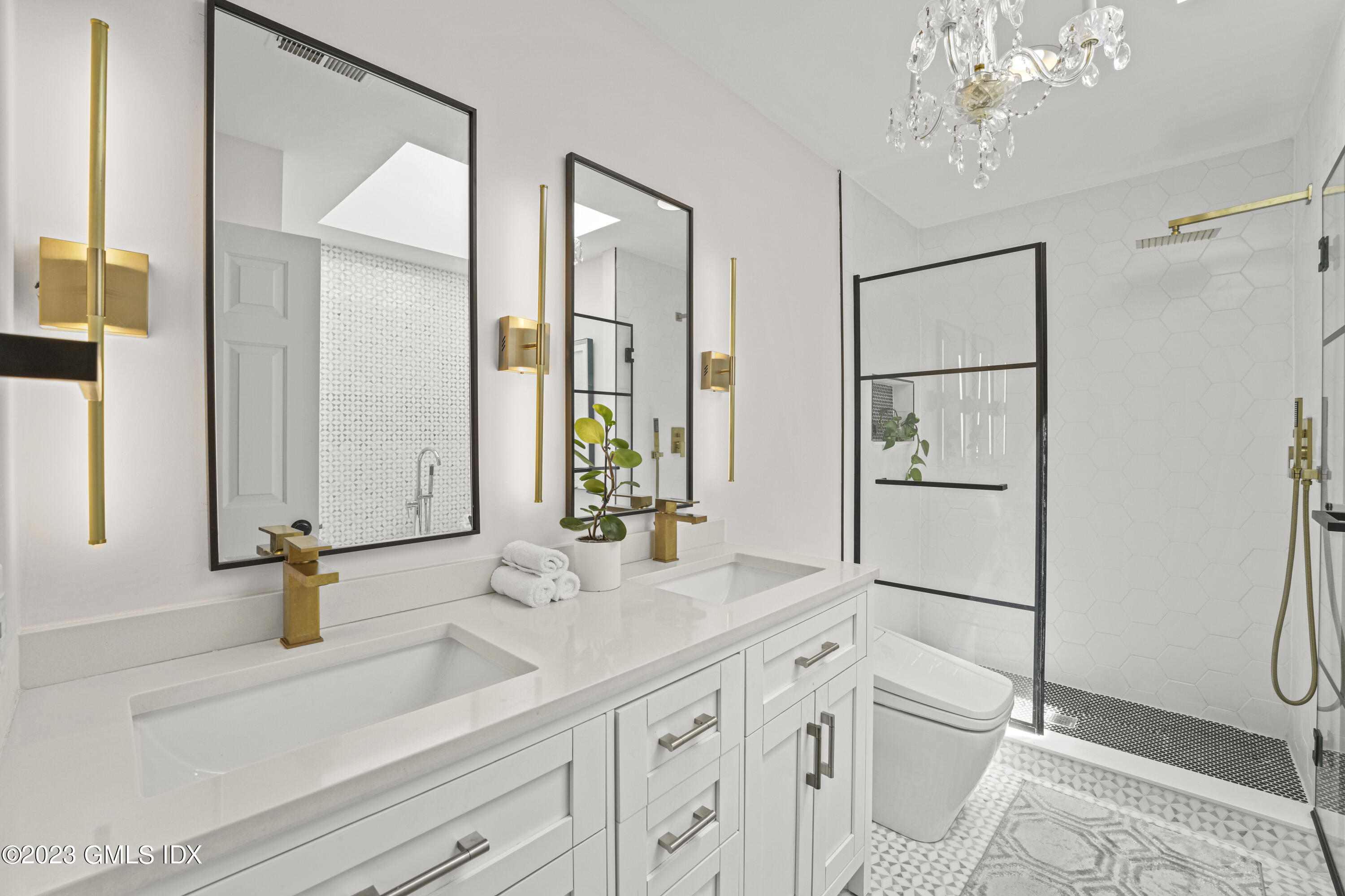 172 Field Point Road, Unit 6 Greenwich, CT 06830 - Photo 16 of 36 a bathroom with a double vanity sink mirror and shower
