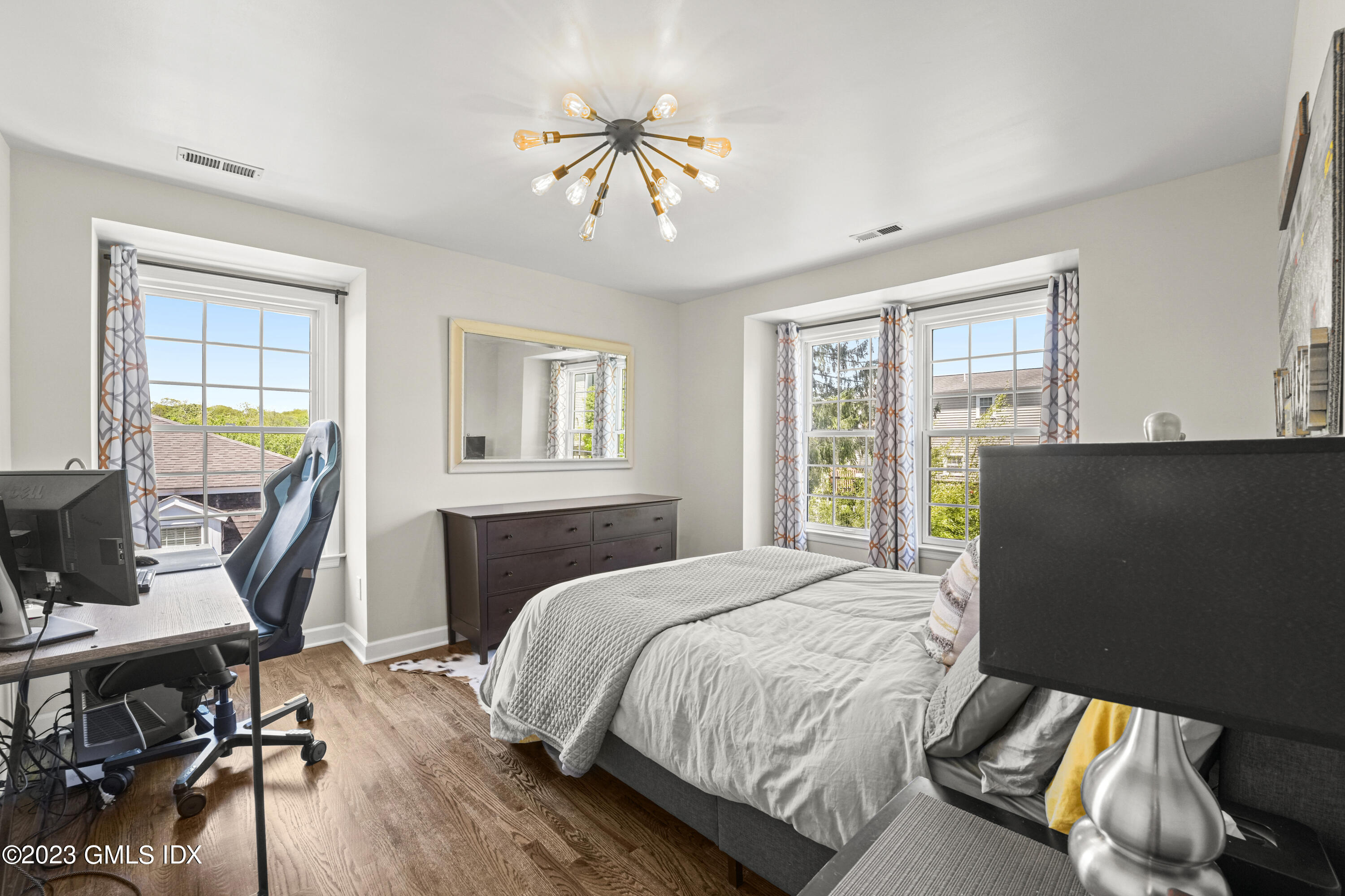 172 Field Point Road, Unit 6 Greenwich, CT 06830 - Photo 23 of 36 a bedroom with a bed furniture and a window
