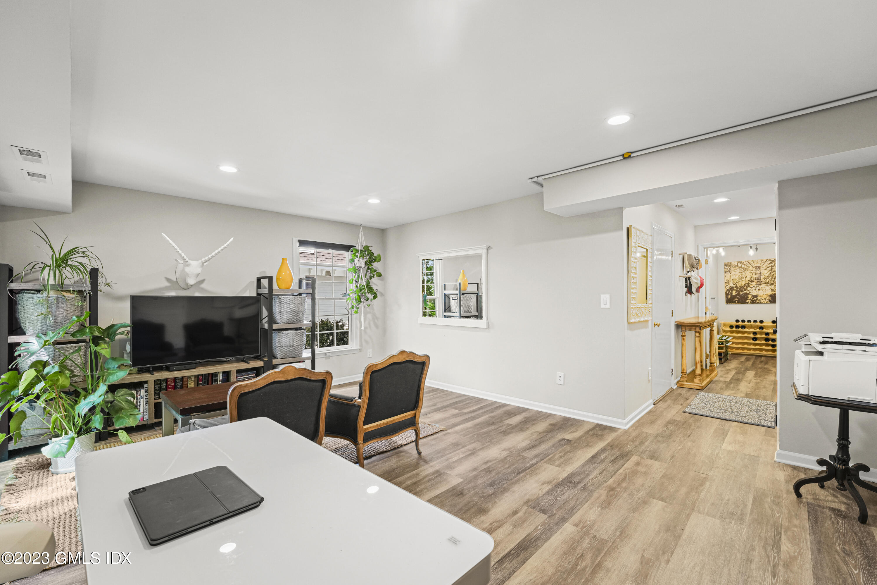 172 Field Point Road, Unit 6 Greenwich, CT 06830 - Photo 27 of 36 a living room with furniture and a flat screen tv