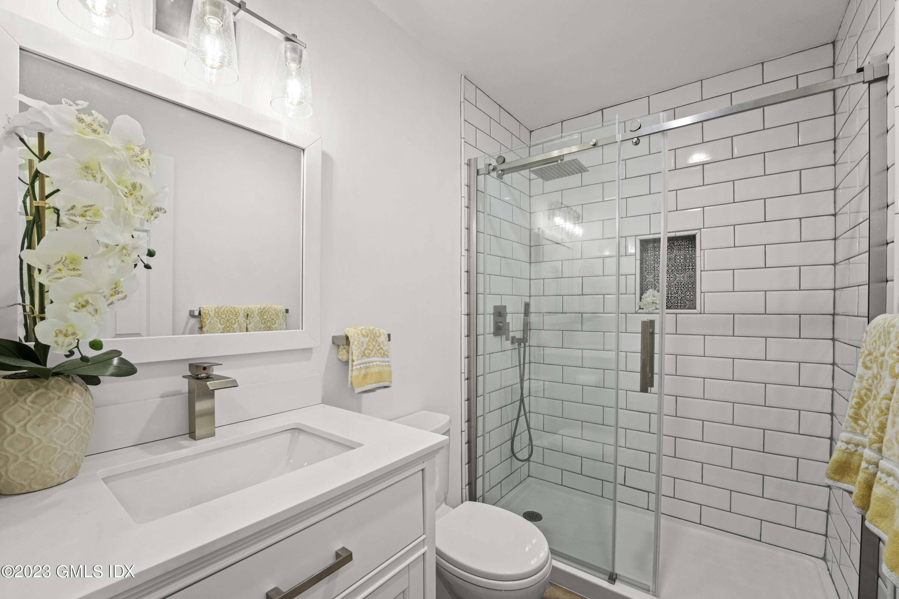 172 Field Point Road, Unit 6 Greenwich, CT 06830 - Photo 29 of 36 a bathroom with a sink a toilet and shower