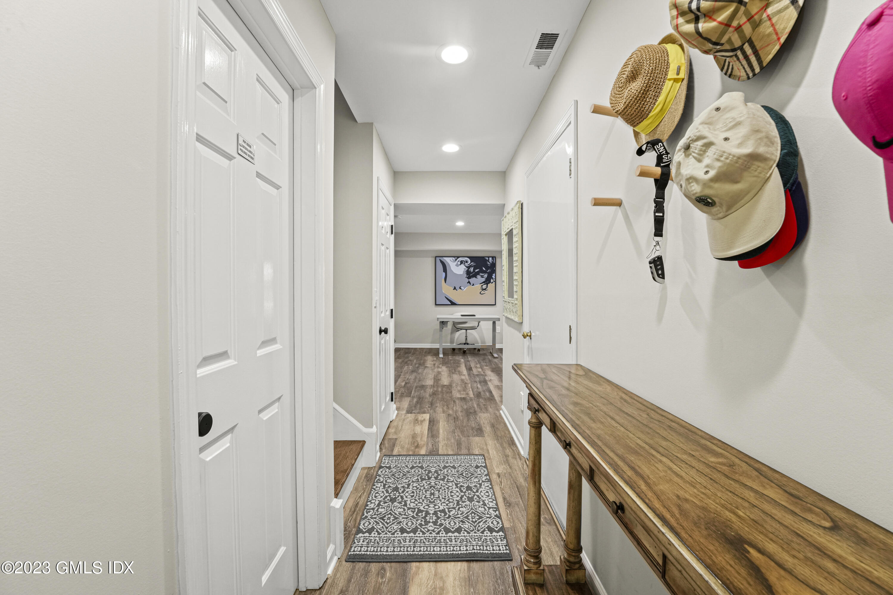 172 Field Point Road, Unit 6 Greenwich, CT 06830 - Photo 30 of 36 a view of a hallway with wooden floor and entryway