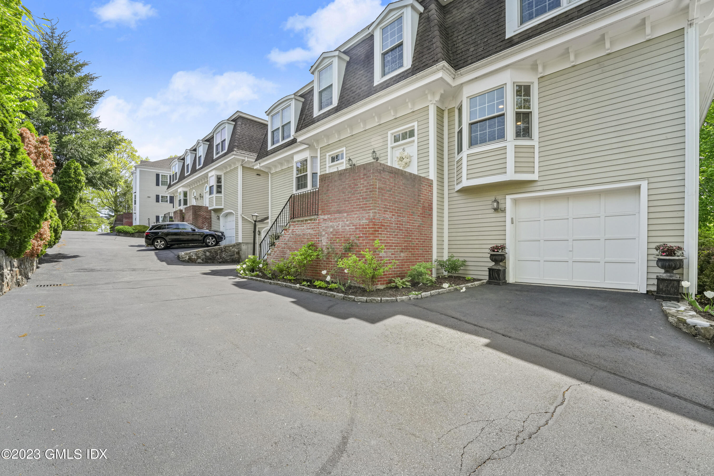 172 Field Point Road, Unit 6 Greenwich, CT 06830 - Photo 32 of 36 a view of a street with a building