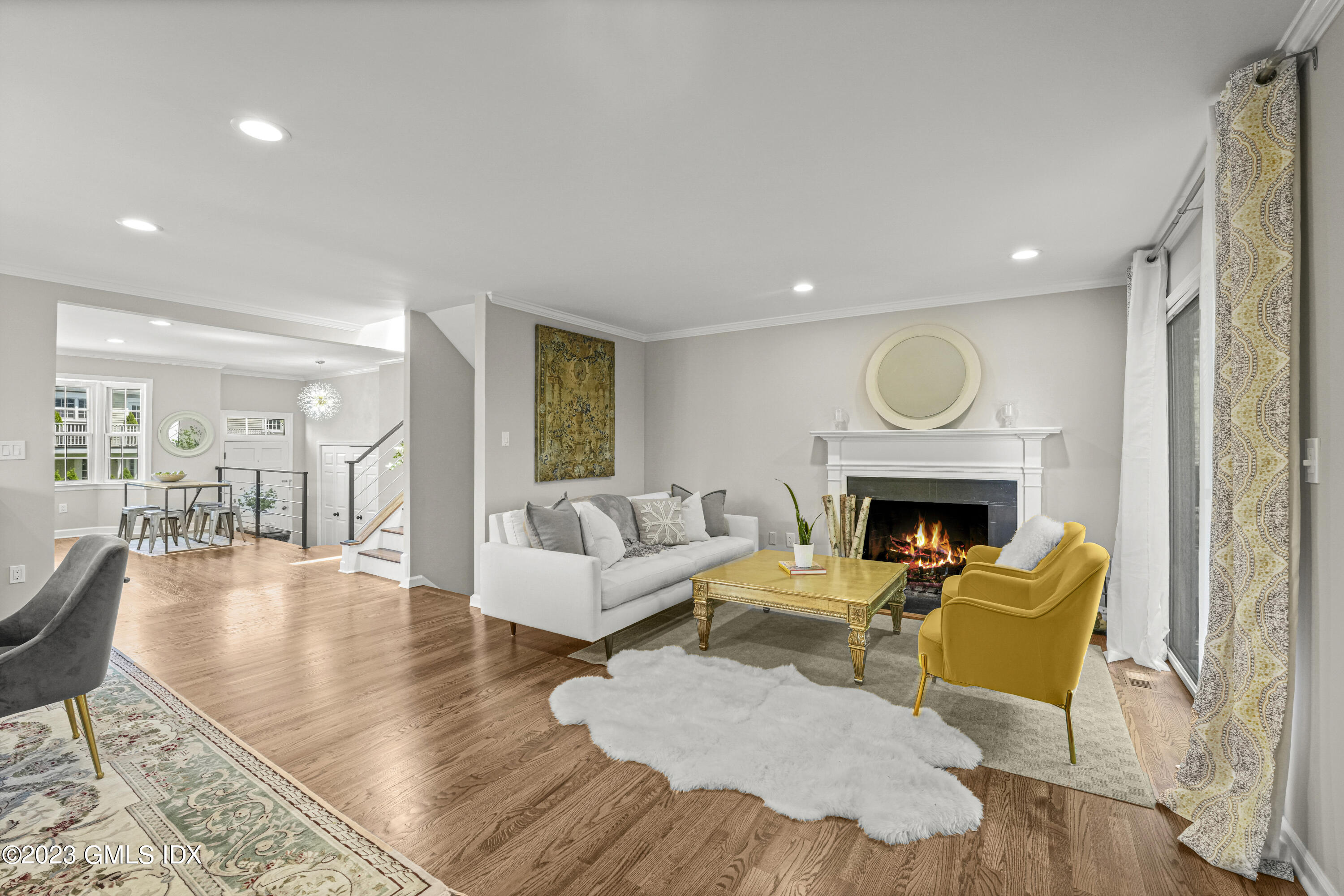 172 Field Point Road, Unit 6 Greenwich, CT 06830 - Photo 4 of 36 a living room with fireplace furniture and a fireplace