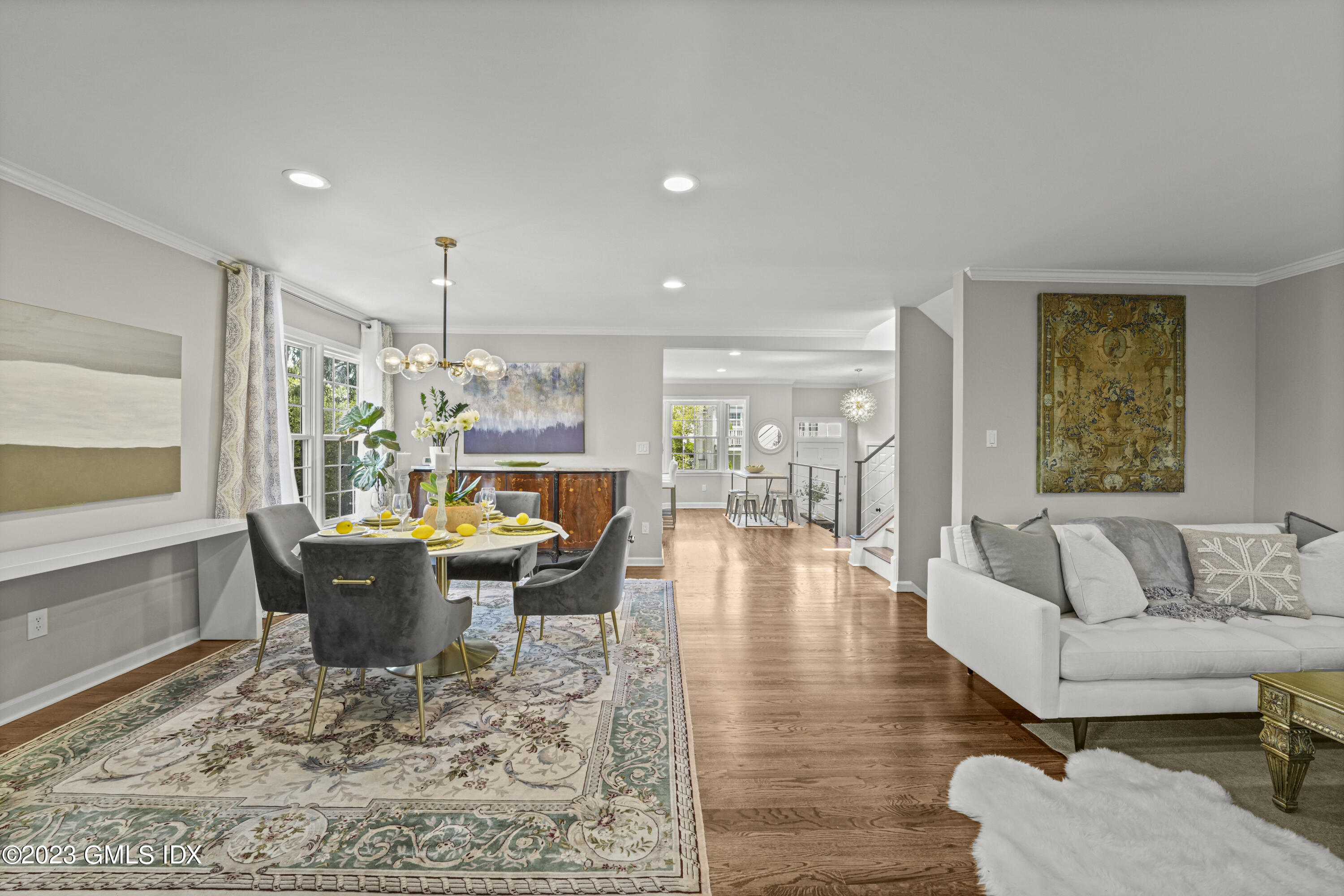 172 Field Point Road, Unit 6 Greenwich, CT 06830 - Photo 5 of 36 a living room with furniture and a large window