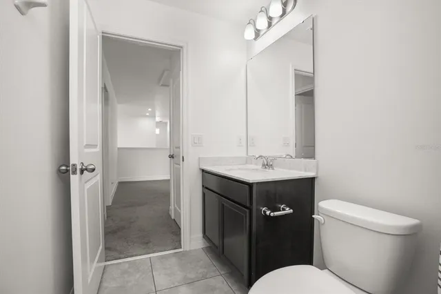 a bedroom with a bed and a chair