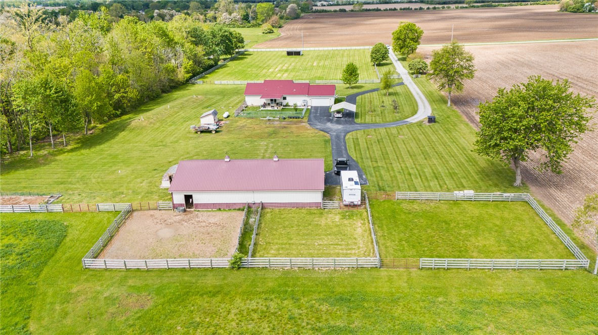 4222 Ramsey Road Springfield, OH 45502 - Photo 21 of 79 This expansive rural property offers a serene landscape with a main residence and equestrian facilities.