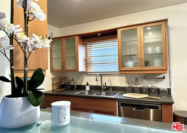 a kitchen with a sink and a stove