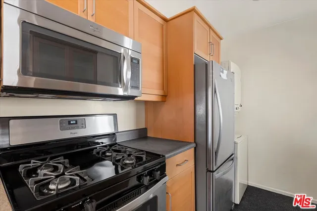 a kitchen with a stove and a microwave
