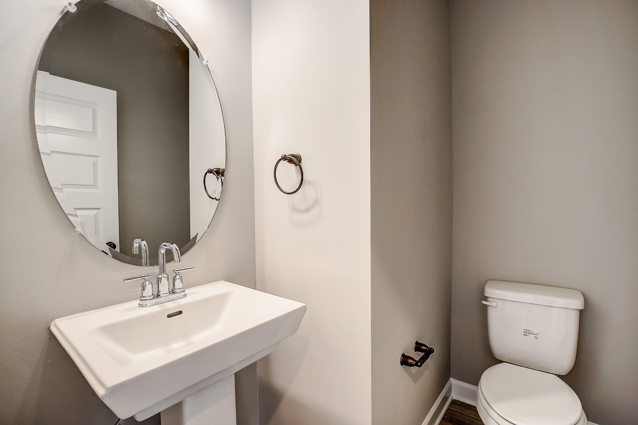 1776 Fenway Loop Antioch, TN 37013 - Photo 17 of 39 a bathroom with a toilet a sink and mirror