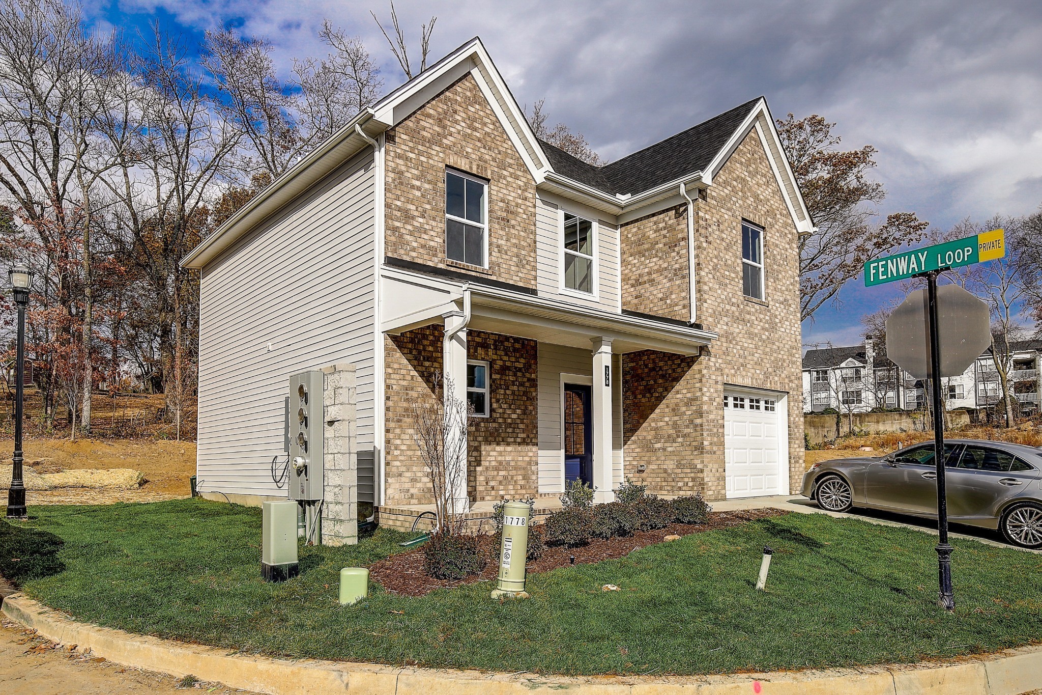 1776 Fenway Loop Antioch, TN 37013 - Photo 2 of 39 a front view of a house with a yard