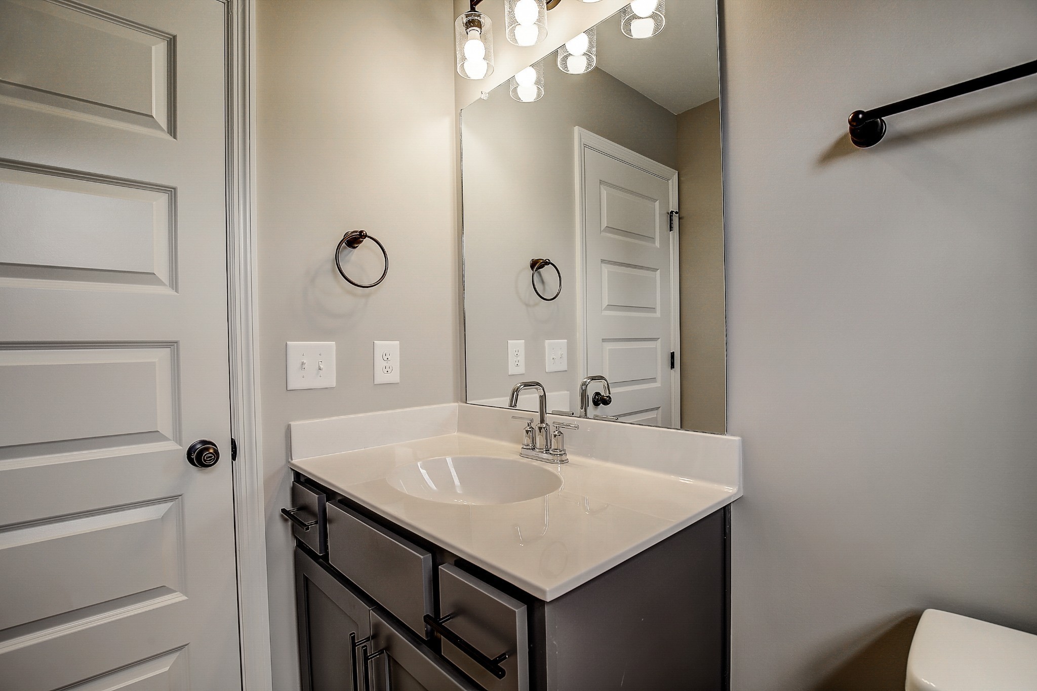 1776 Fenway Loop Antioch, TN 37013 - Photo 23 of 39 a bathroom with a sink a light fixture and a mirror