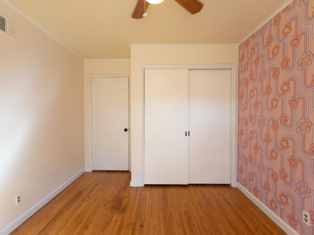 1089 Ivy Road Memphis, TN 38117 - Photo 22 of 32 a view of an empty room with wooden floor