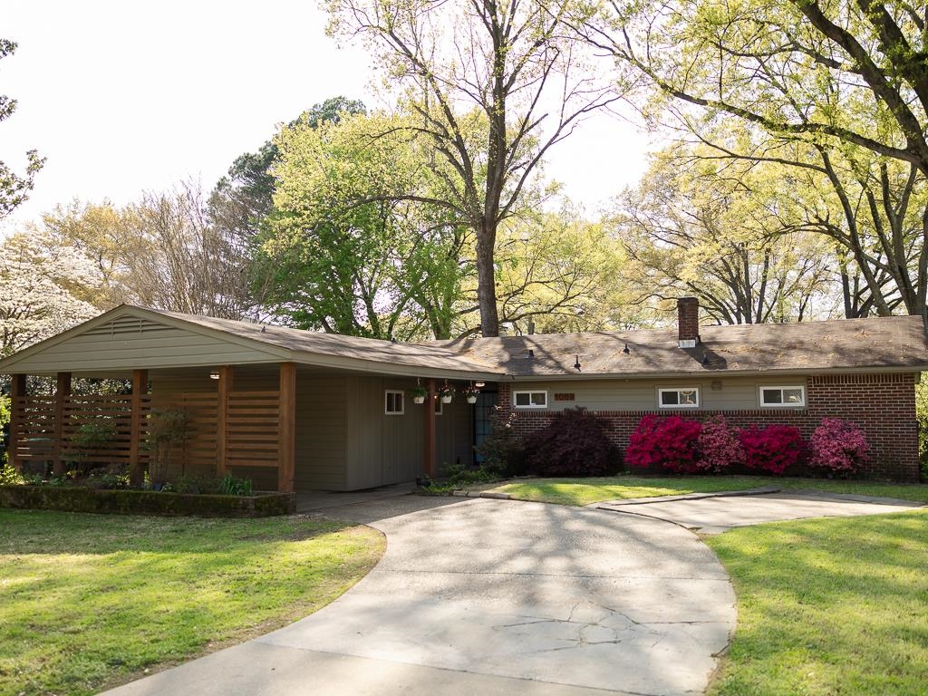 1089 Ivy Road Memphis, TN 38117 - Photo 3 of 32 a front view of a house with a yard