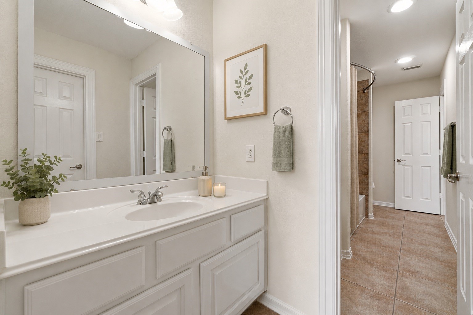 2716 Silverstone Way Conroe, TX 77304 - Photo 19 of 27 A full jack-and-jill bath serves 2 of the 3 upstairs bedrooms. Virtually staged.