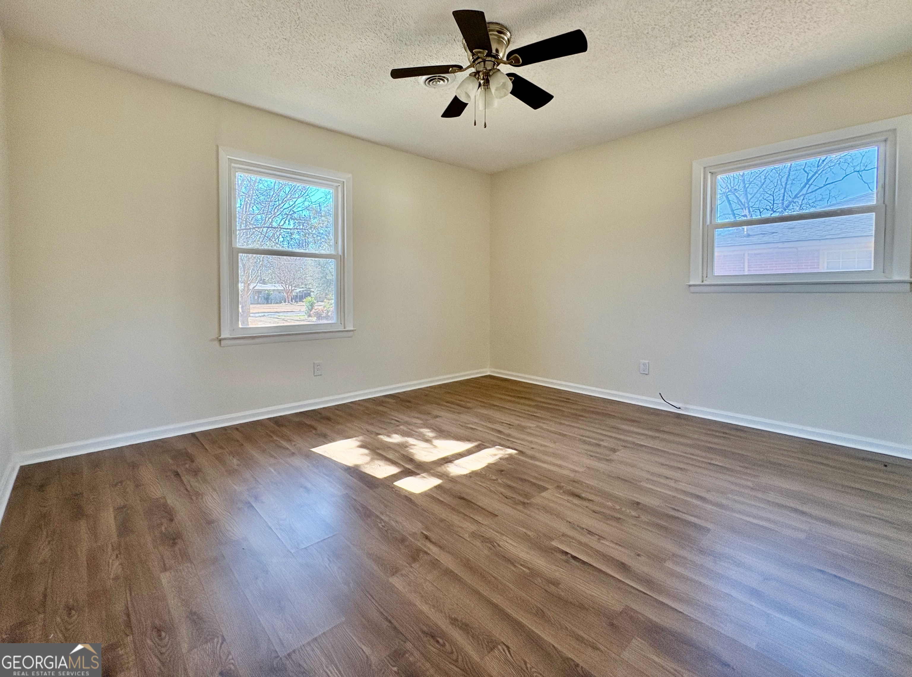 404 Magnolia Street Fort Valley, GA 31030 - Photo 12 of 21 a view of empty room with wooden floor