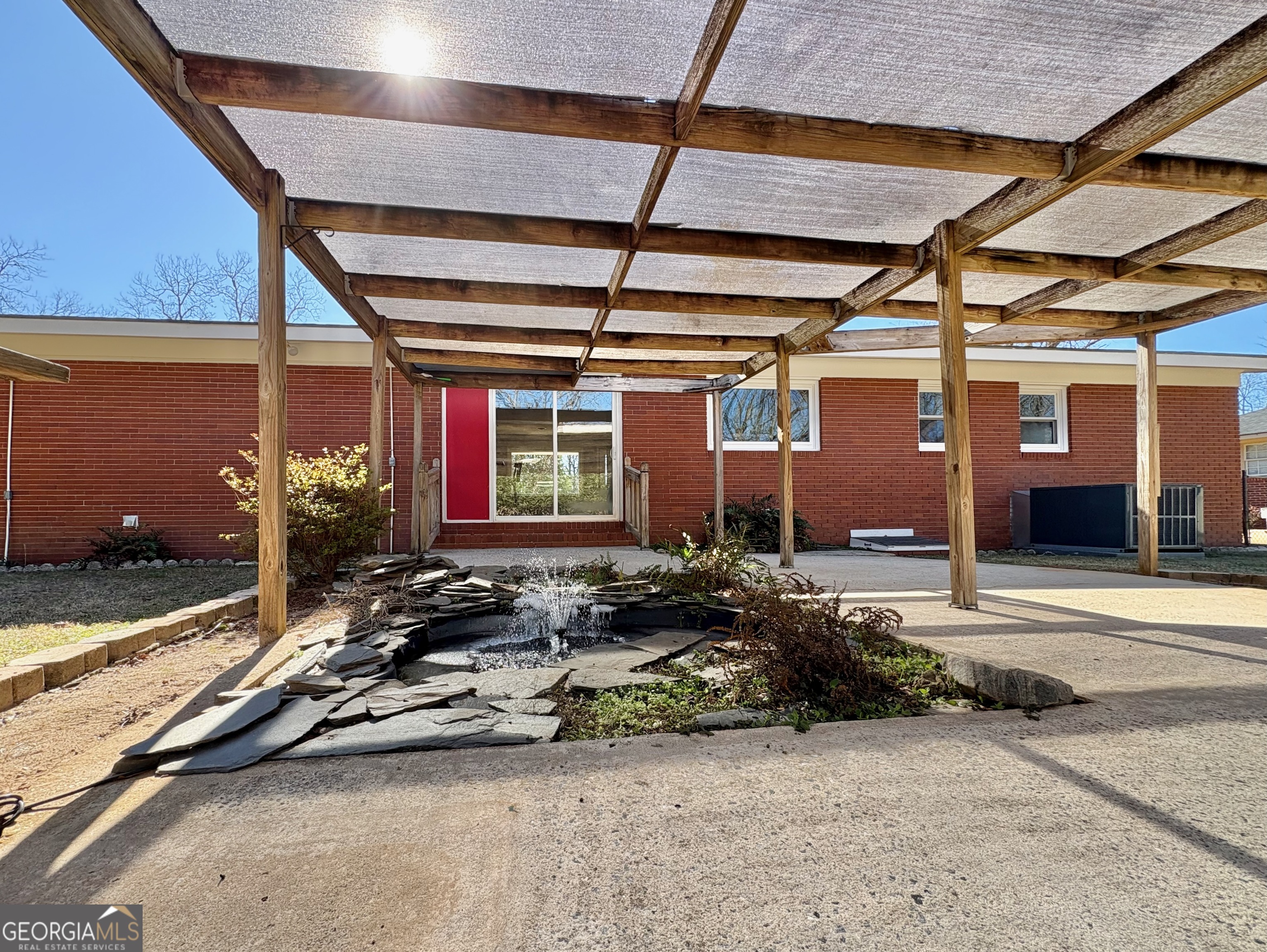 404 Magnolia Street Fort Valley, GA 31030 - Photo 16 of 21 a view of a garage with car parked