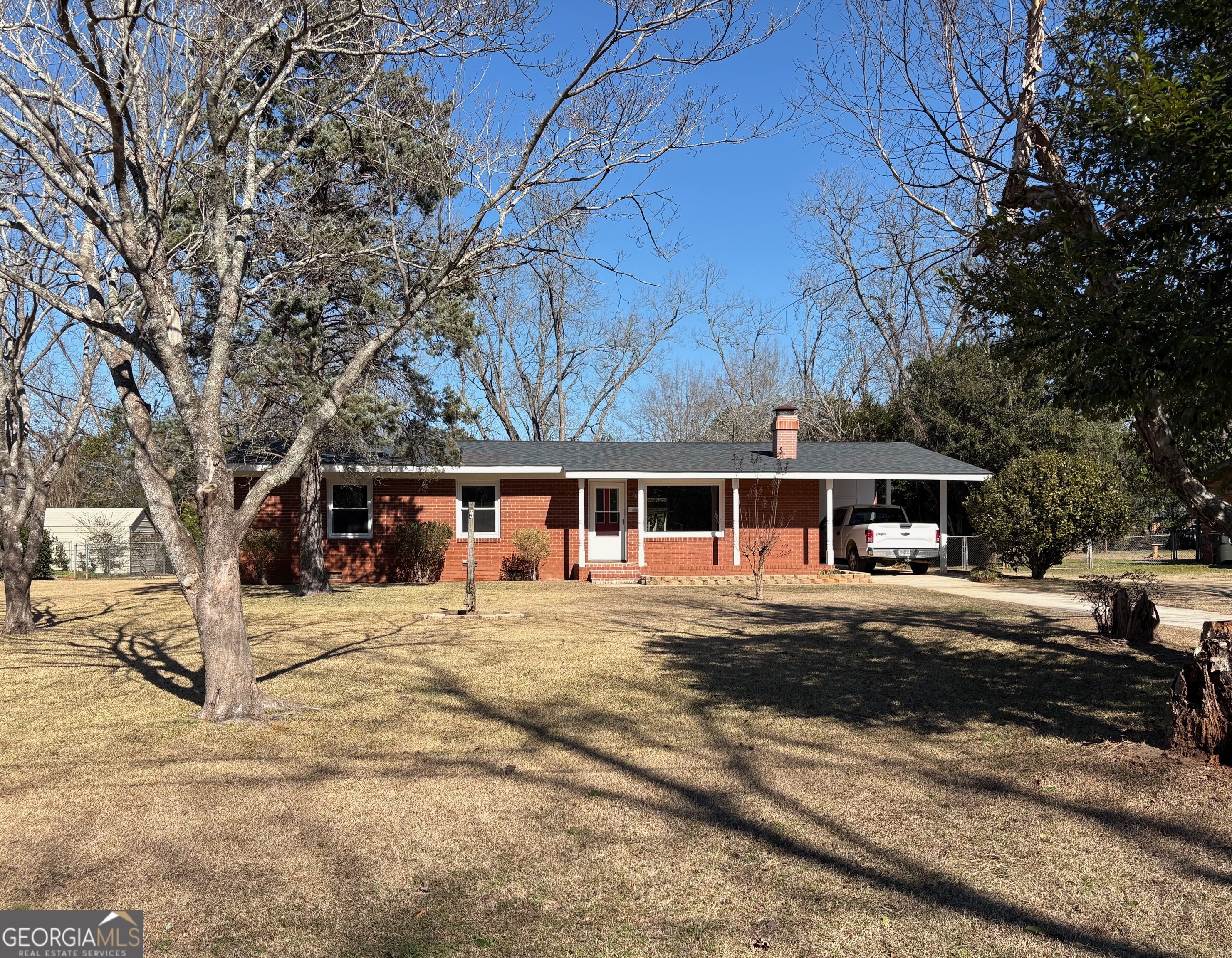 404 Magnolia Street Fort Valley, GA 31030 - Photo 2 of 21 a front view of a house with a yard