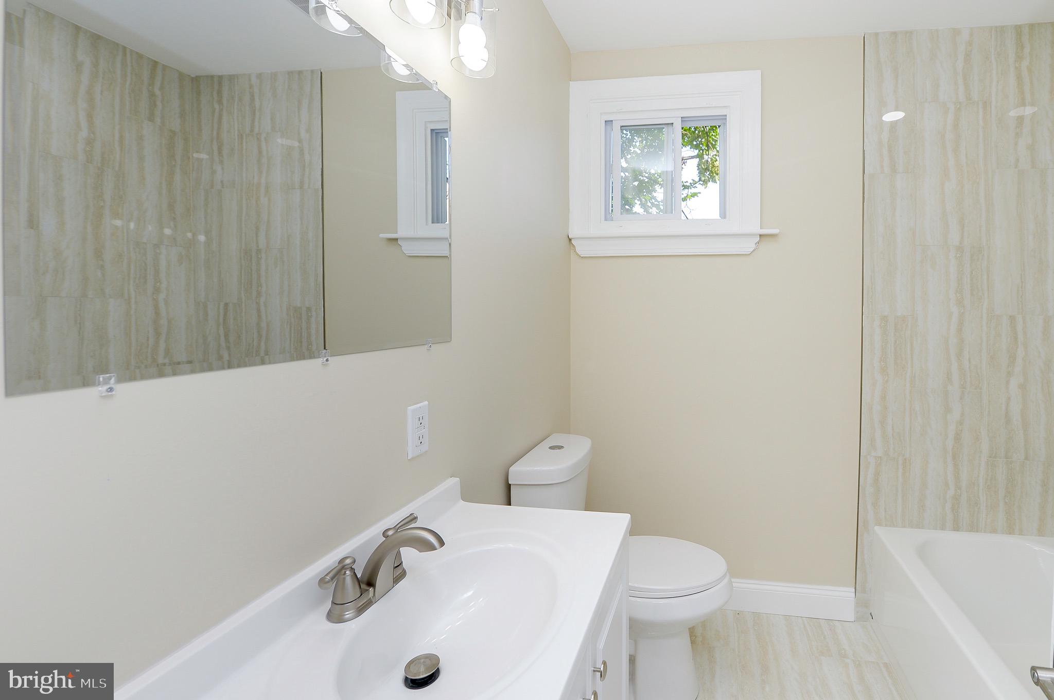 537 Church Road Elkins Park, PA 19027 - Photo 25 of 39 a bathroom with a sink and a toilet