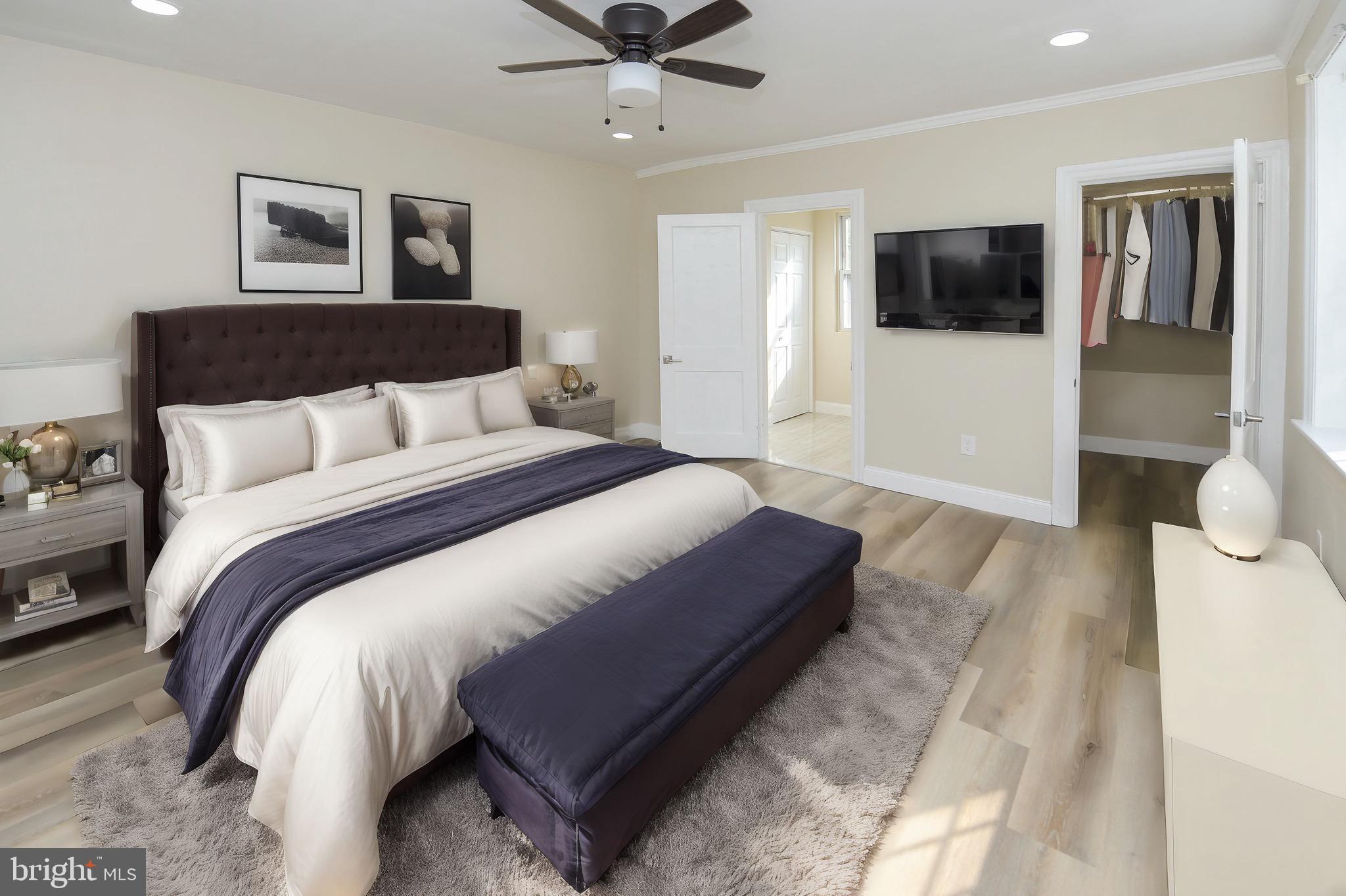 537 Church Road Elkins Park, PA 19027 - Photo 26 of 39 a spacious bedroom with a bed and a flat screen tv