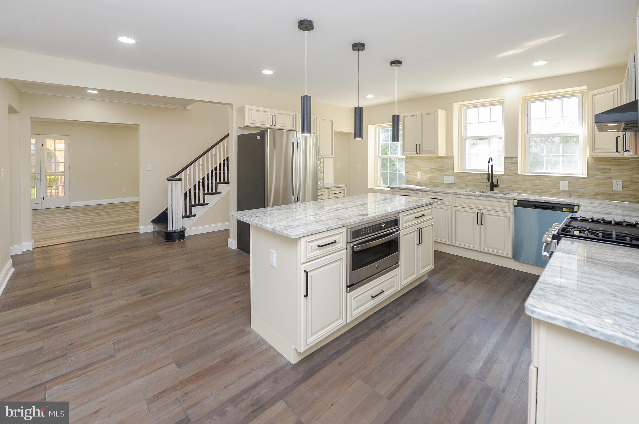 537 Church Road Elkins Park, PA 19027 - Photo 10 of 39 a kitchen with a stove a sink and a refrigerator