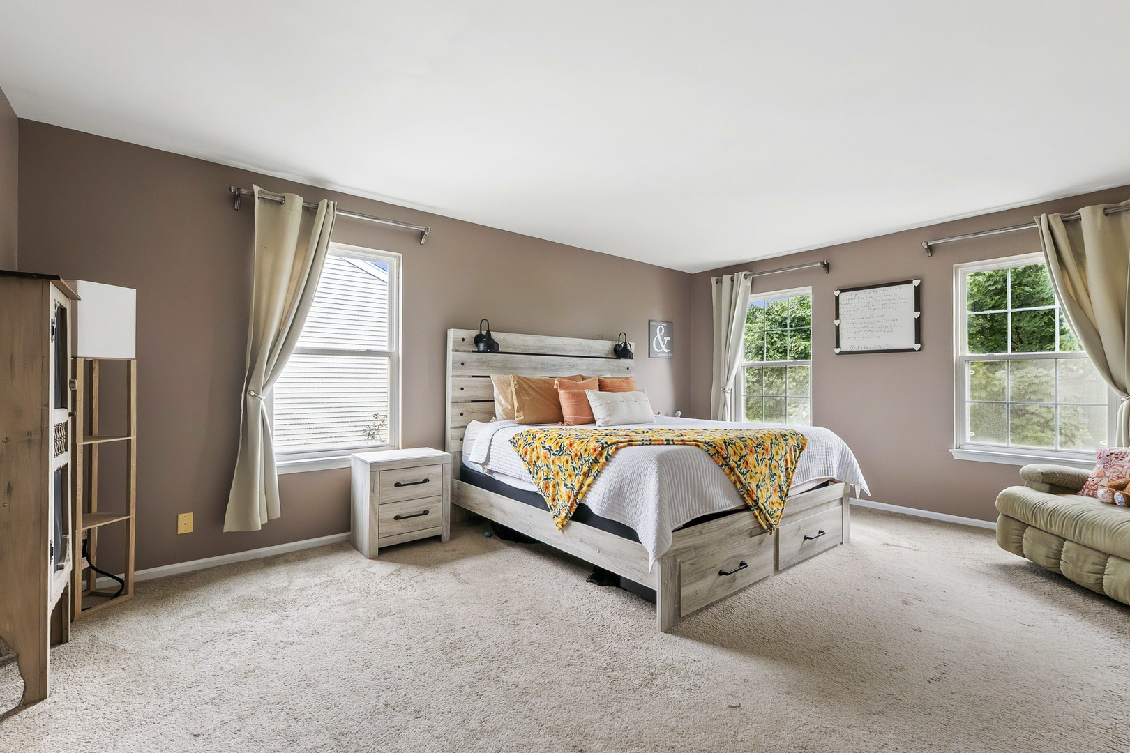 712 Wilson Street Waterman, IL 60556 - Photo 11 of 24 a bed sitting in a bedroom next to a window