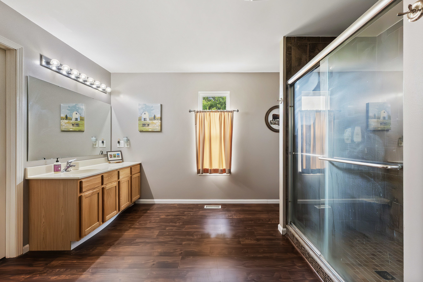 712 Wilson Street Waterman, IL 60556 - Photo 13 of 24 a bathroom with a double vanity sink and a mirror