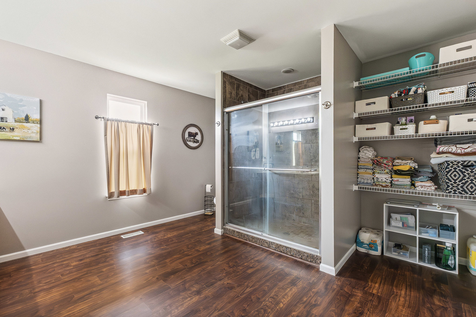 712 Wilson Street Waterman, IL 60556 - Photo 14 of 24 a view of an empty room with window and wooden floor