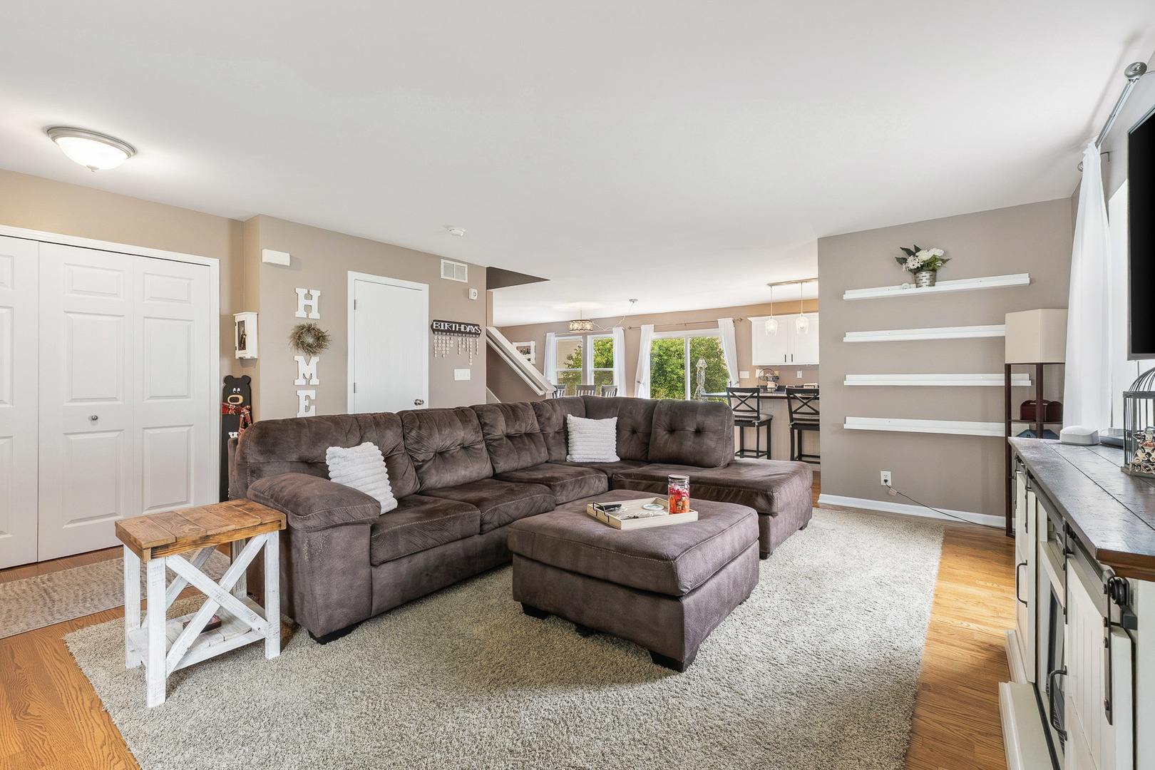 712 Wilson Street Waterman, IL 60556 - Photo 2 of 24 a living room with furniture and a wooden floor