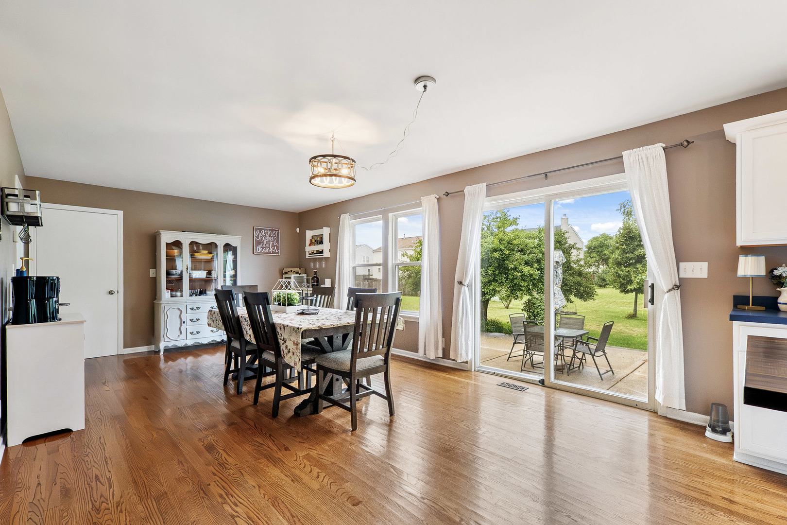 712 Wilson Street Waterman, IL 60556 - Photo 8 of 24 a view of a dining room with furniture window and wooden floor