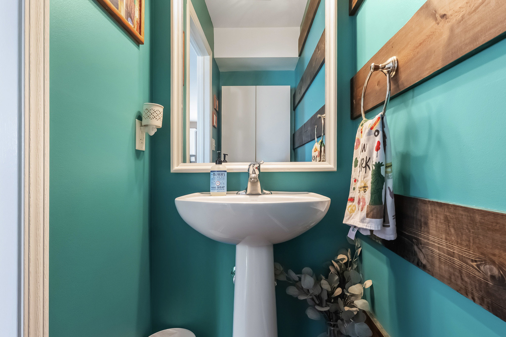 712 Wilson Street Waterman, IL 60556 - Photo 10 of 24 a bathroom with a sink and a mirror