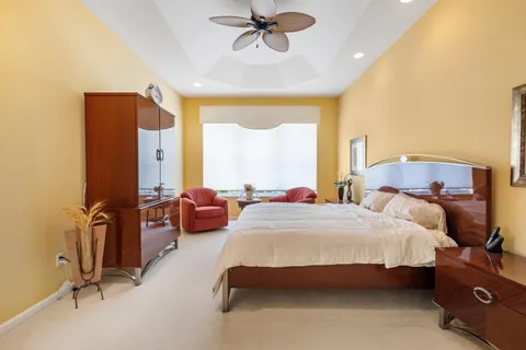 a bedroom with bed and window