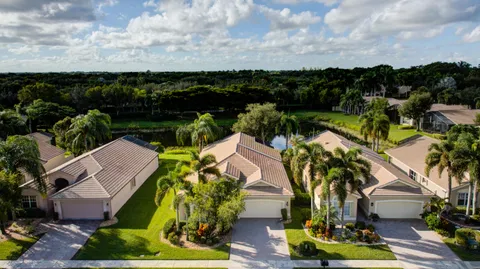 a view of swimming pool yard and lake view