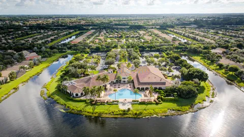 an aerial view of residential houses with outdoor space and street view