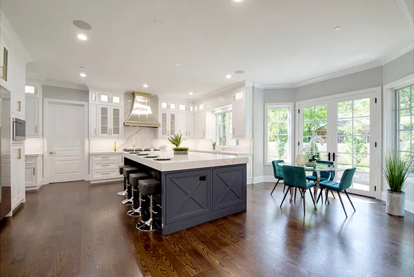 a bathroom with a granite countertop sink mirror vanity and bathtub