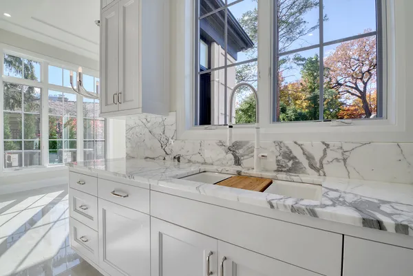 a kitchen with stainless steel appliances granite countertop a stove and a sink