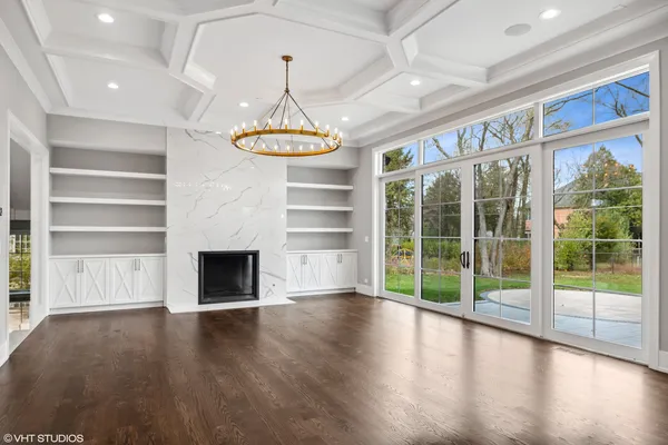 a large kitchen with granite countertop a large counter top stainless steel appliances and cabinets
