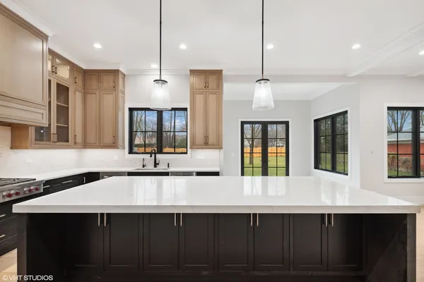 a view of an empty room with a fireplace and a window