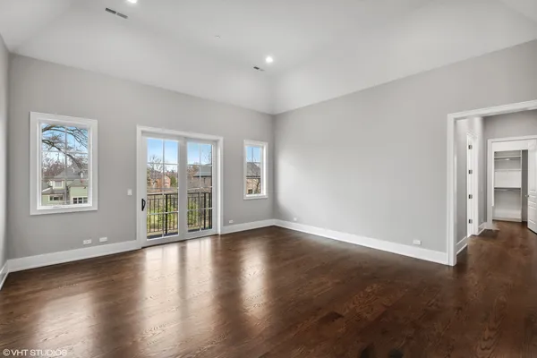 a bathroom with a granite countertop sink two mirror and a