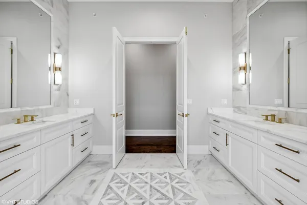 a white bath tub sitting next to a shower