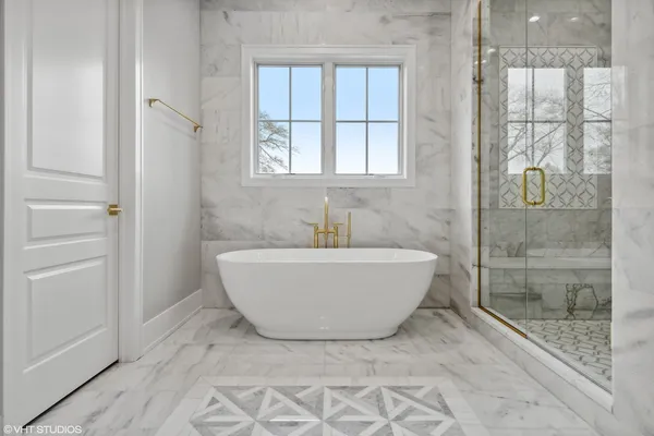 a bathroom with a double vanity sink toilet and shower
